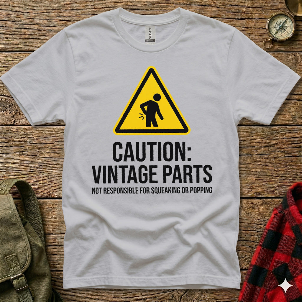 White t-shirt with "Caution: Vintage Parts Not Responsible for Squeaking or Popping" text and a warning sign.