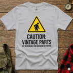 White t-shirt with "Caution: Vintage Parts Not Responsible for Squeaking or Popping" text and a warning sign.