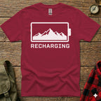 Maroon t-shirt with a white mountain range inside a battery outline and the word "RECHARGING".