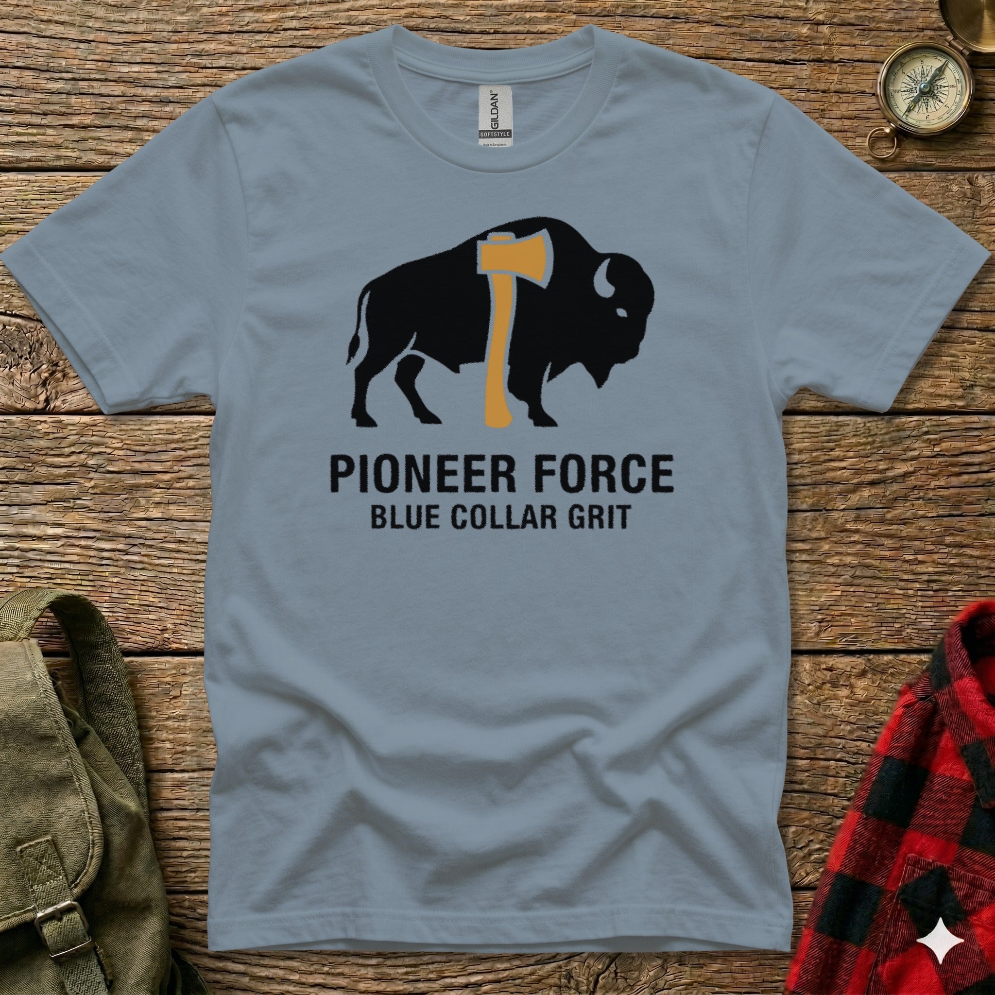 Blue t-shirt with black bison and axe graphic, "PIONEER FORCE BLUE COLLAR GRIT" text.