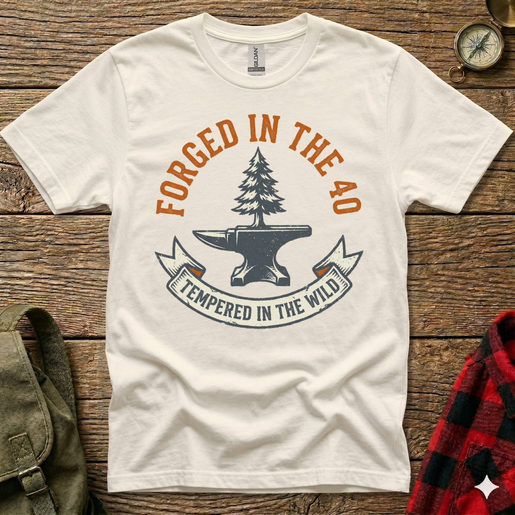 White t-shirt with "Forged in the 40, Tempered in the Wild" graphic.