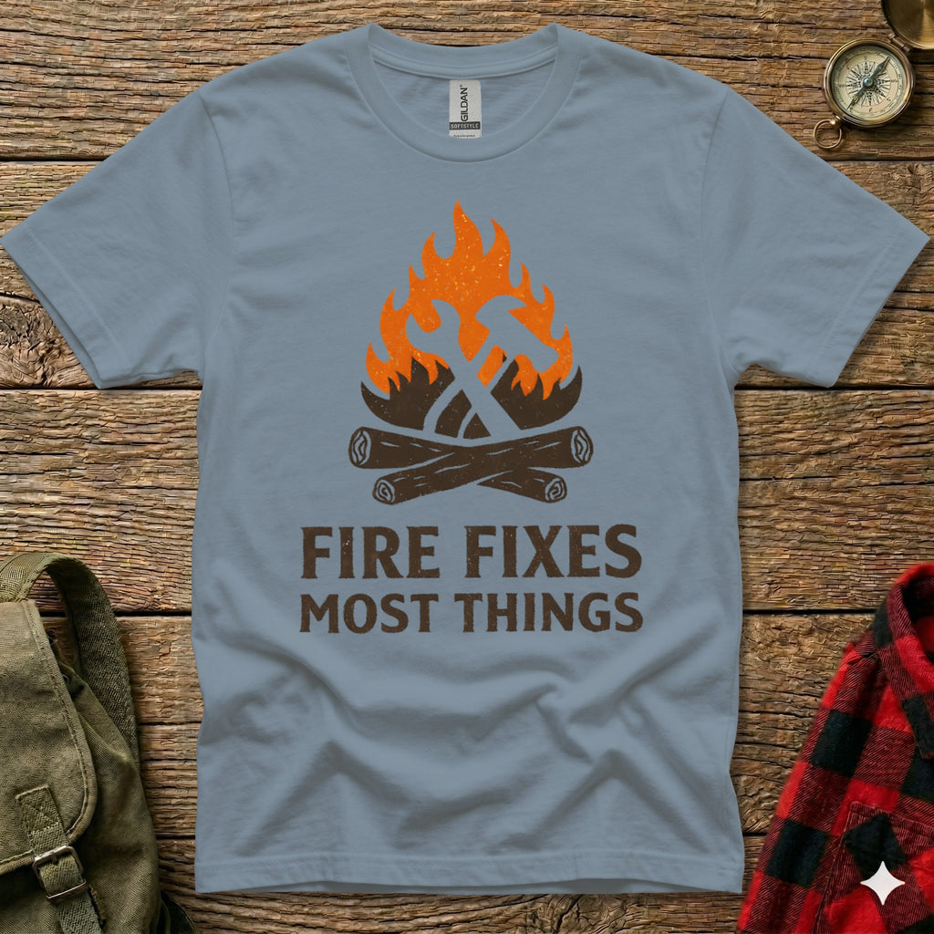 Blue t-shirt with "Fire Fixes Most Things" and campfire graphic.