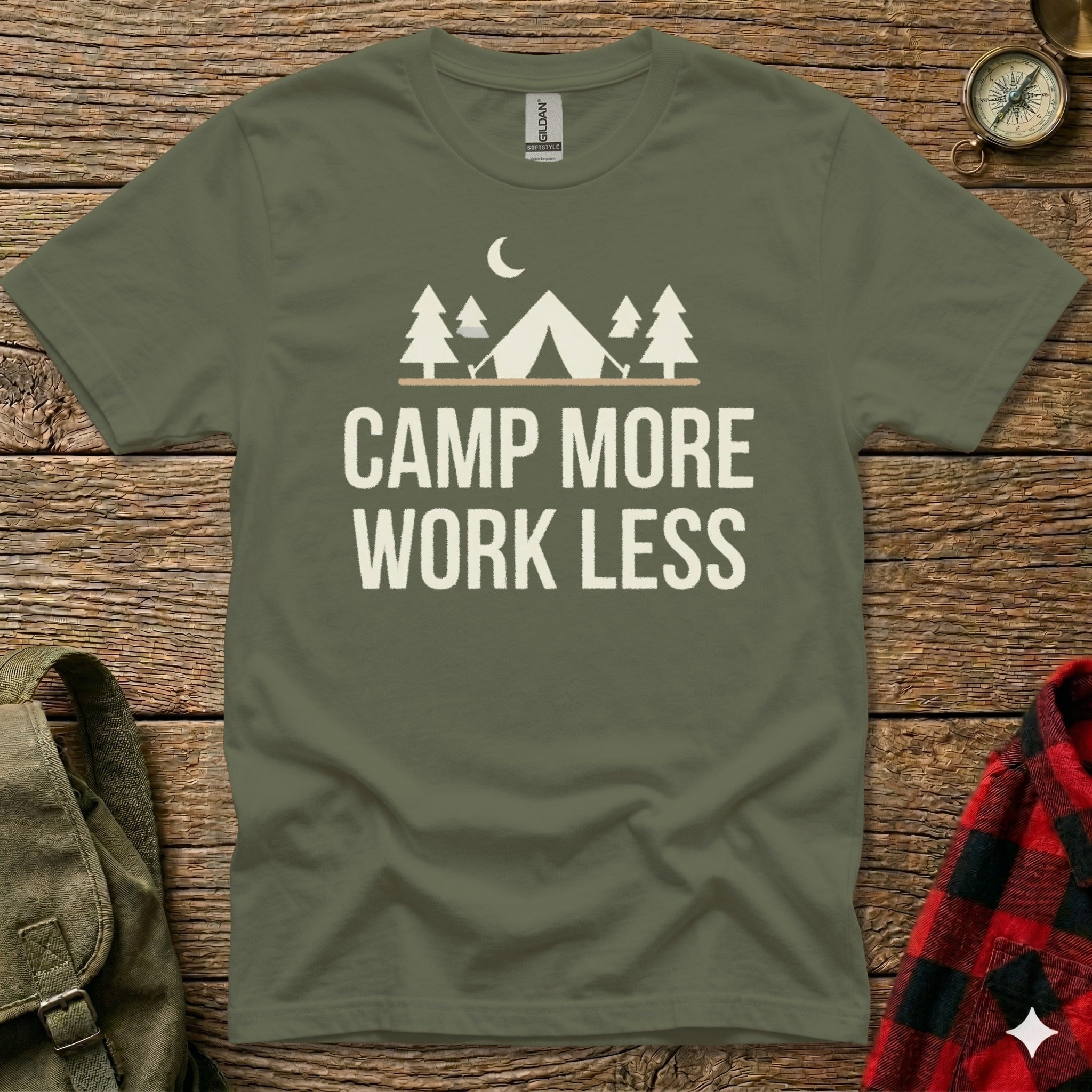 Green t-shirt with "Camp More Work Less" text and camping graphic.