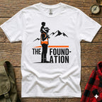 White t-shirt with "The Foundation" logo featuring a father carrying a child on his shoulders.