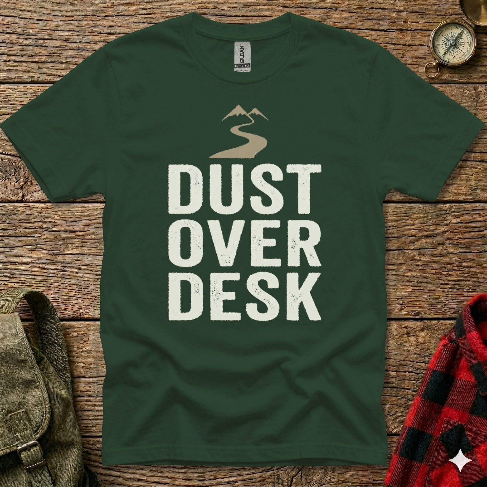 Green t-shirt with "Dust Over Desk" text and mountain graphic.