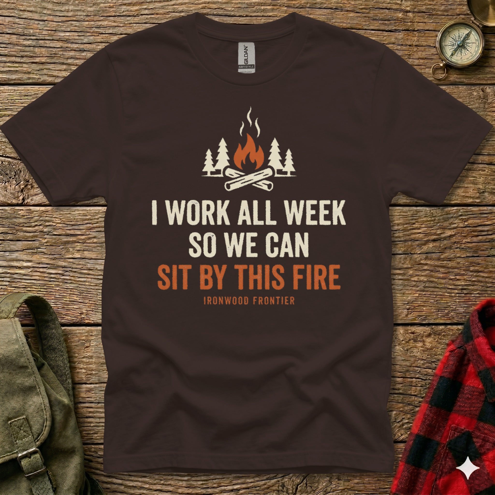 Brown t-shirt with white text and campfire graphic, "I work all week so we can sit by this fire."