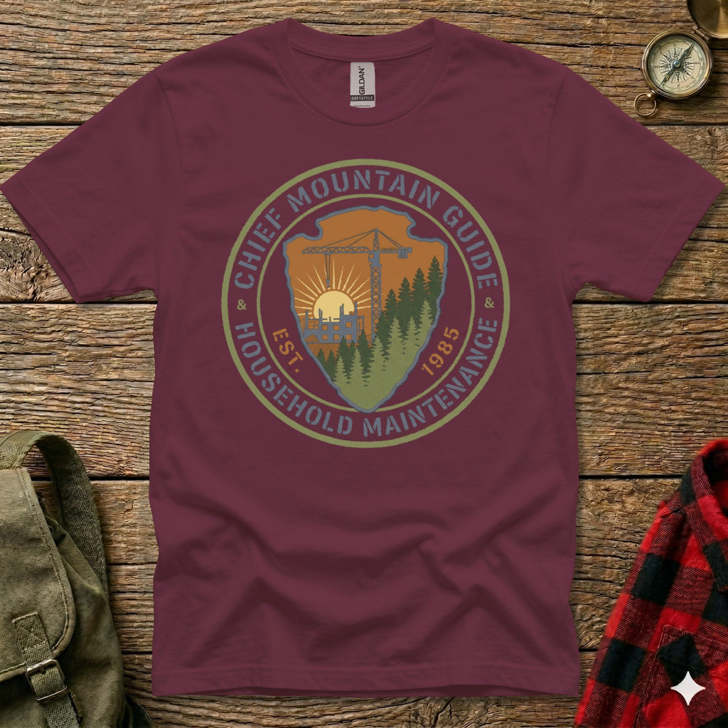 Maroon t-shirt with circular logo: Chief Mountain Guide Household Maintenance Est. 1985.
