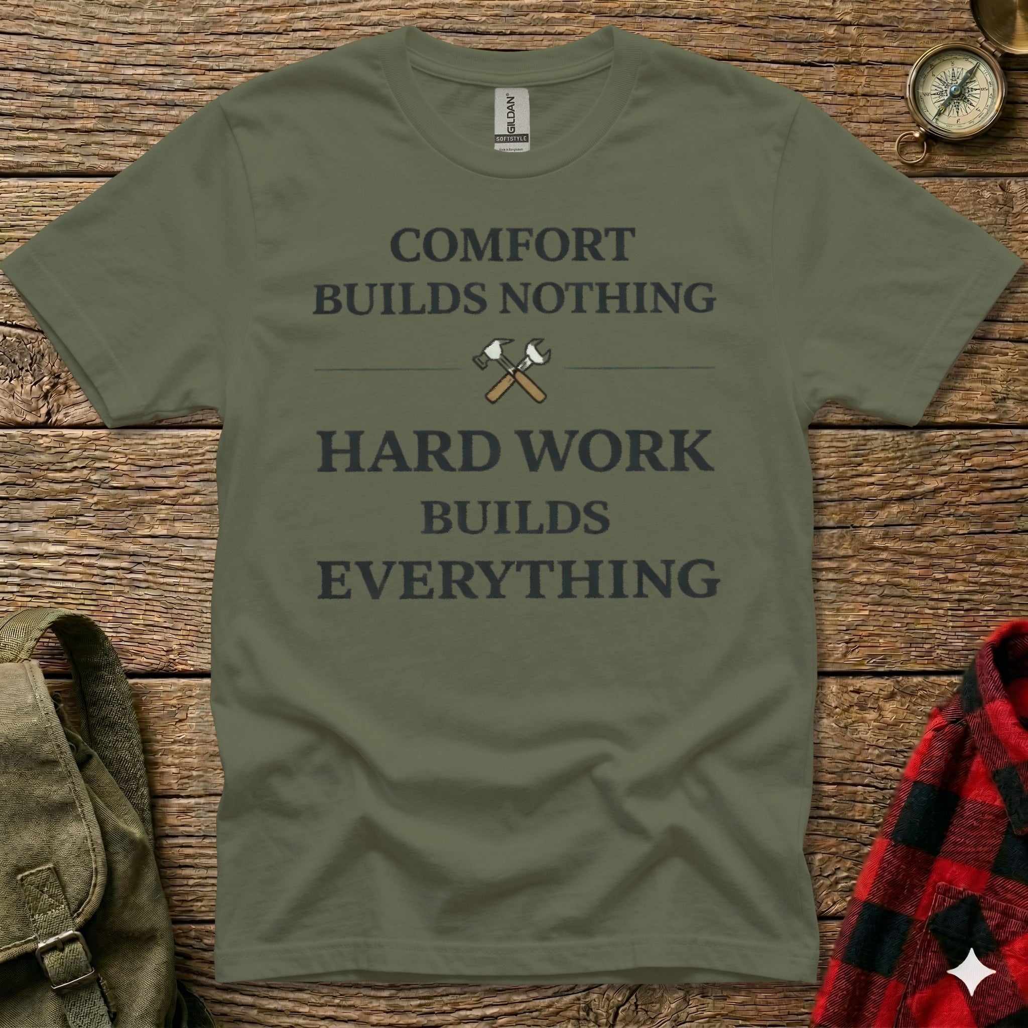 Olive green t-shirt with "Comfort Builds Nothing Hard Work Builds Everything" slogan.