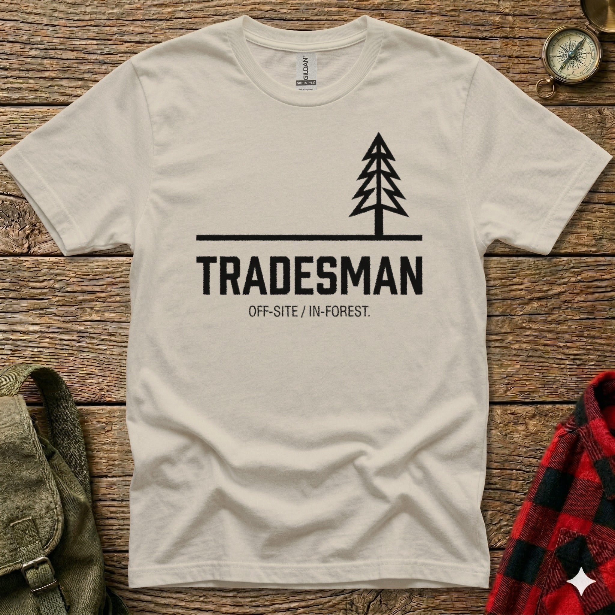 Cream t-shirt with black text and a simple tree graphic.