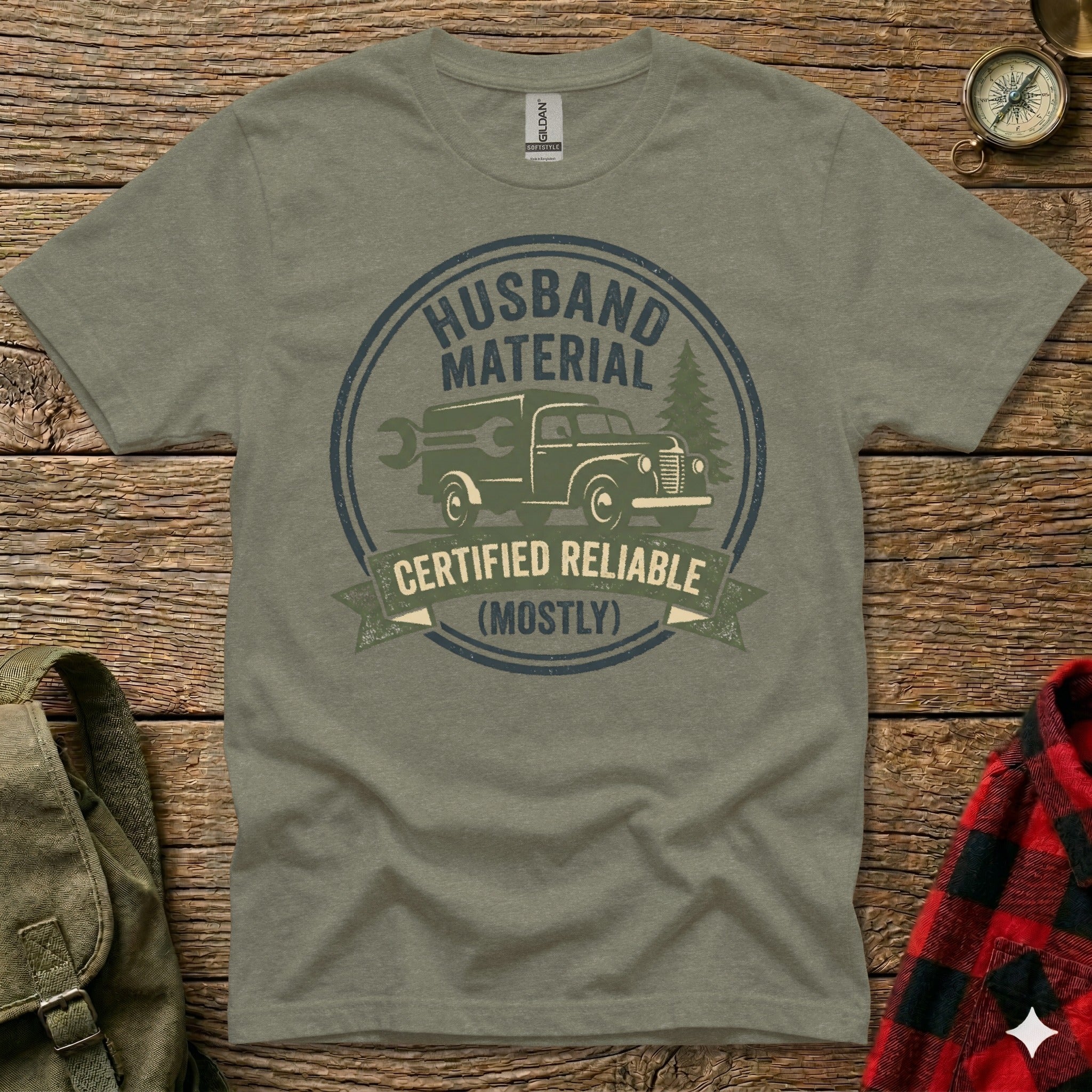 Green t-shirt with "Husband Material Certified Reliable (Mostly)" graphic.
