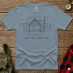 T-shirt with architectural drawing of a lodge and text "BUILT TO SPEC, TESTED BY TRAIL".