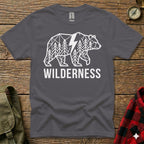 Dark grey t-shirt with geometric forest and lightning bolt design and "WILDERNESS" text.