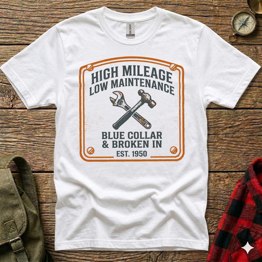 White t-shirt with "High Mileage Low Maintenance Blue Collar" graphic and tools.