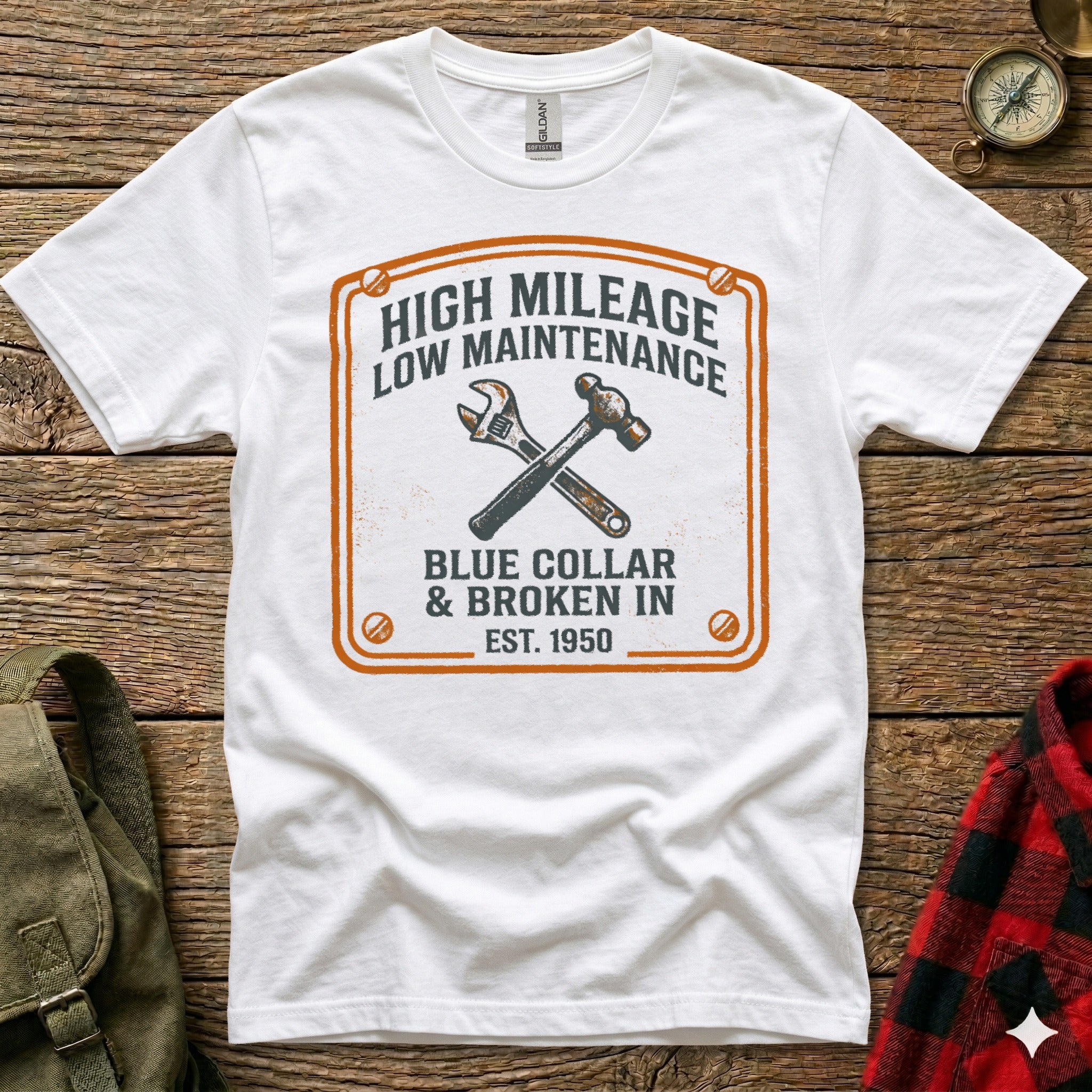 White t-shirt with "High Mileage Low Maintenance Blue Collar" graphic and tools.