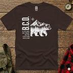 Brown t-shirt with white bear, mountains, and "B.C.D. LIVING ON THAT BLUE COLLAR" text.