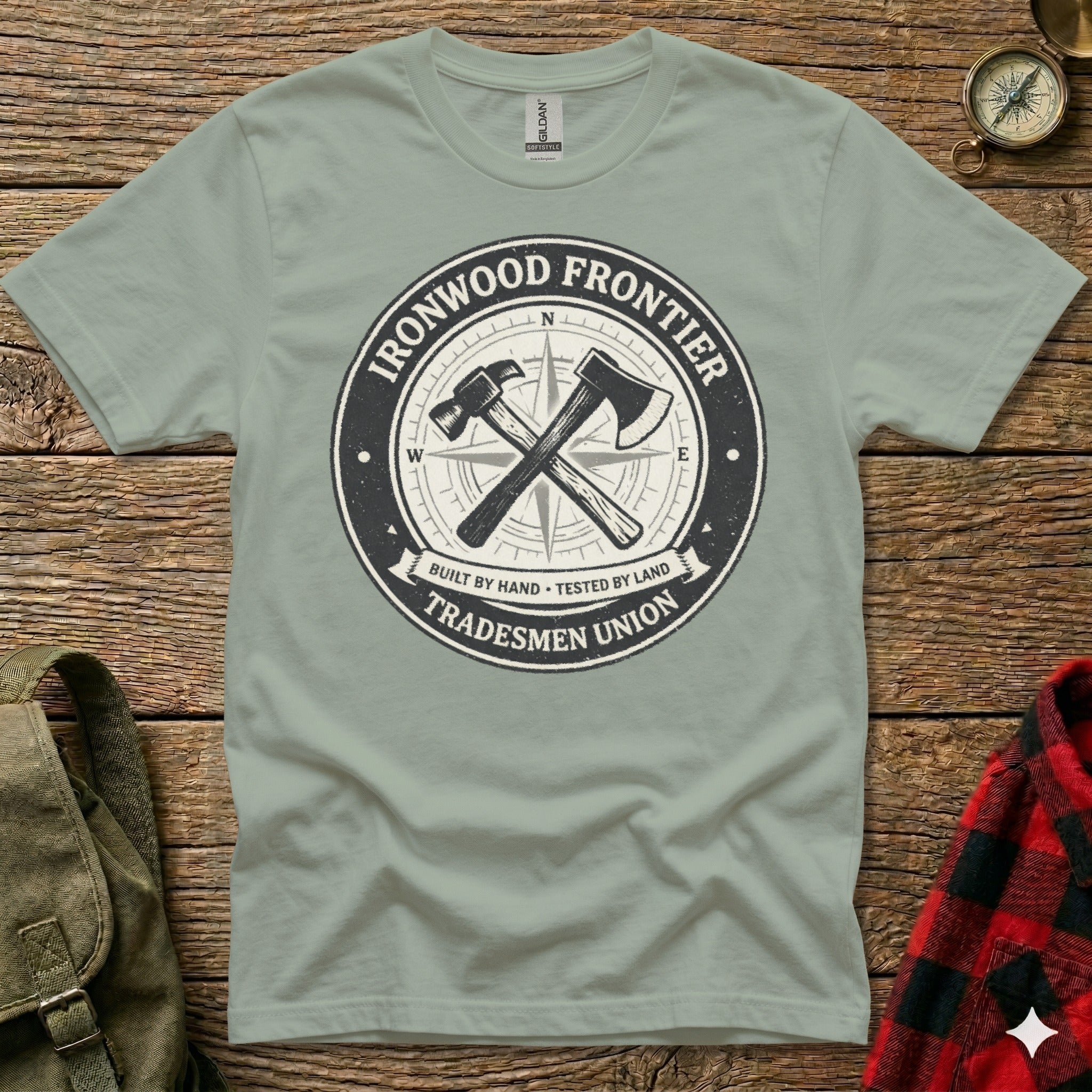 T-shirt with "Ironwood Frontier Tradesmen Union" logo featuring crossed hammer and compass.