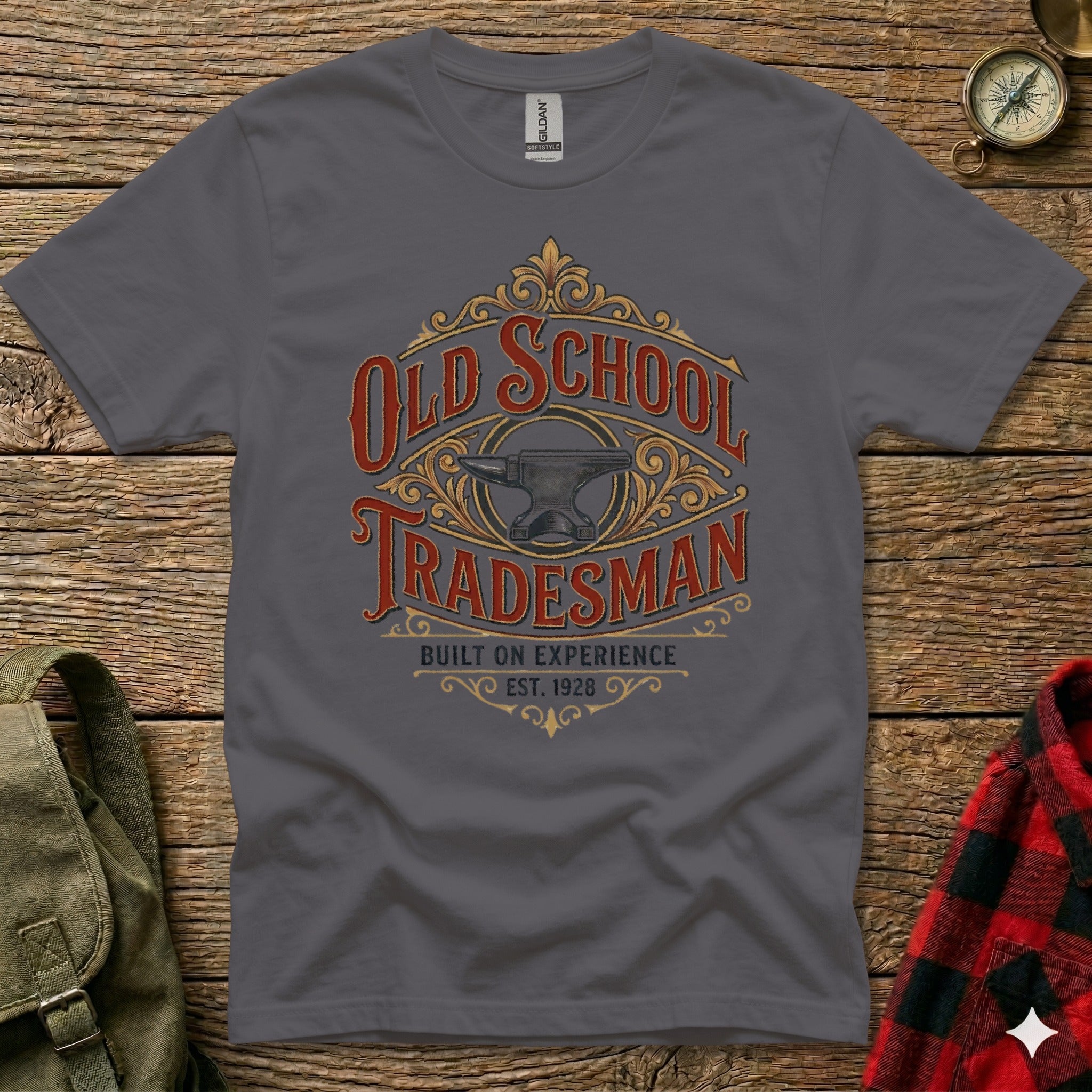 Gray t-shirt with "Old School Tradesman Built on Experience Est. 1928" and anvil graphic.