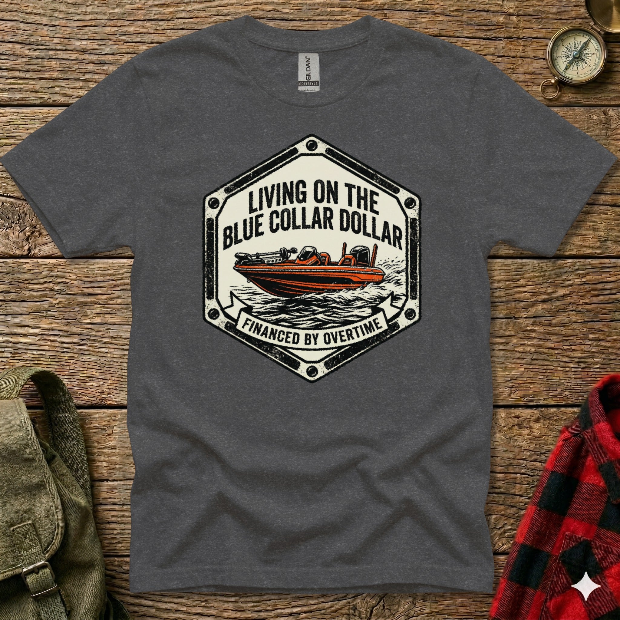 T-shirt graphic with boat, "Living on the Blue Collar Dollar," and "Financed by Overtime."