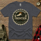 Dark grey t-shirt with circular Ironwood Frontier logo featuring mountains and gear teeth.