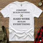 White t-shirt with "COMFORT BUILDS NOTHING HARD WORK BUILDS EVERYTHING" text.