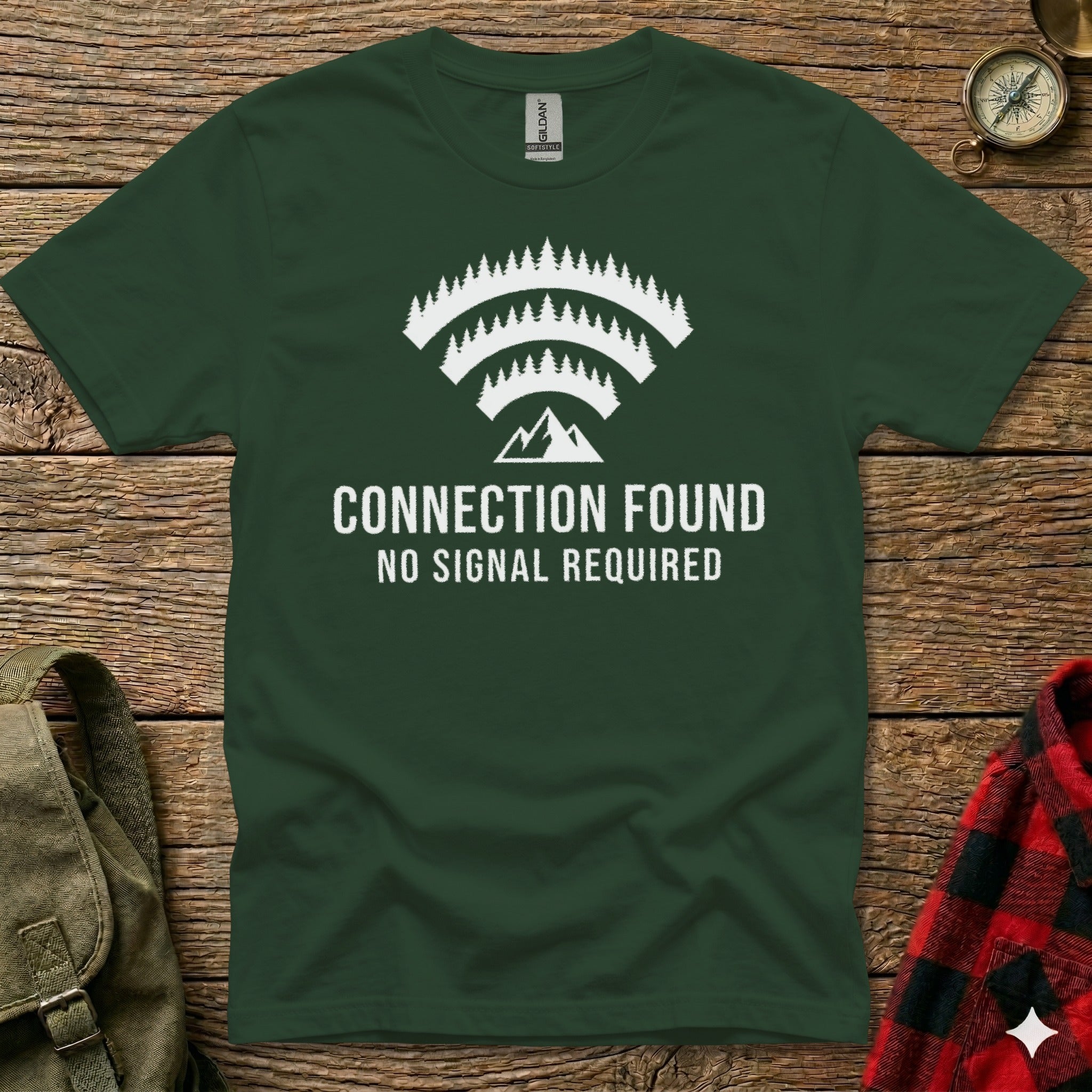 Forest graphic with "CONNECTION FOUND NO SIGNAL REQUIRED" text on green t-shirt.