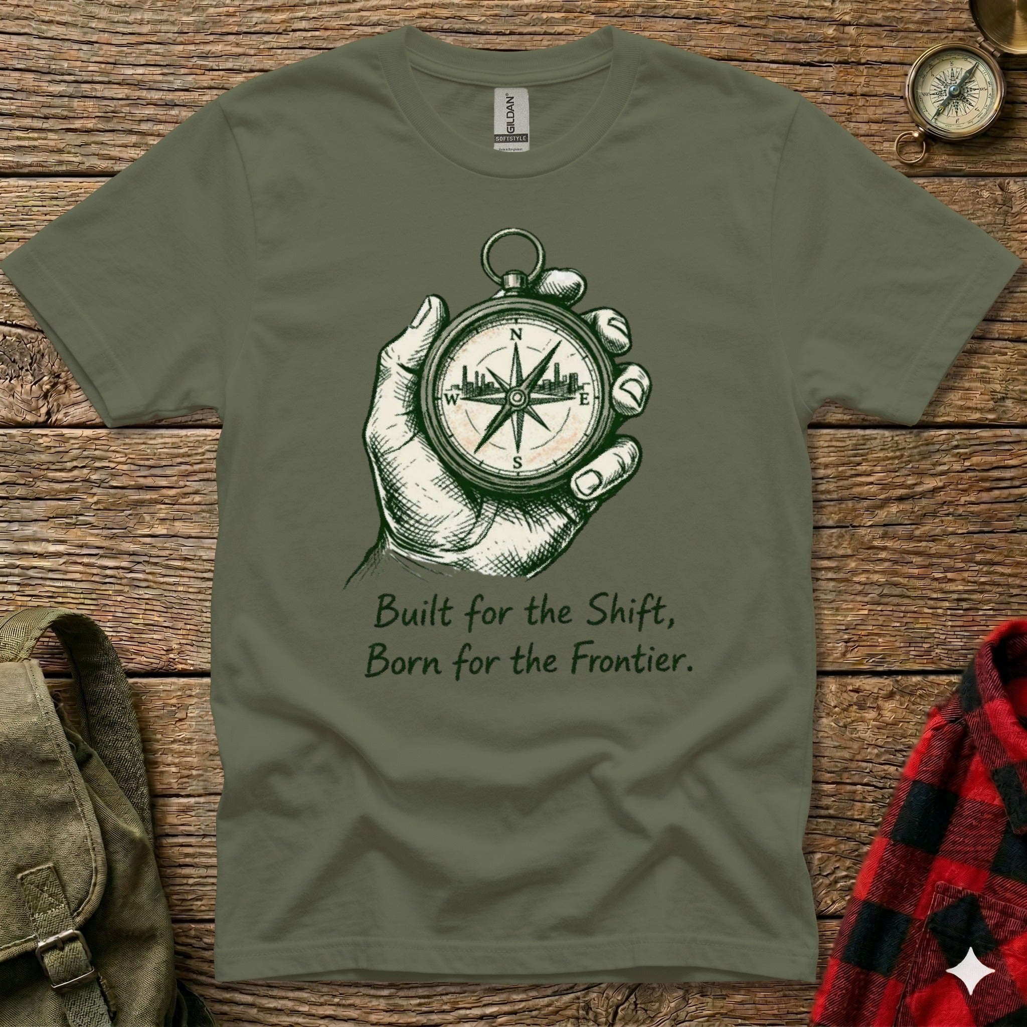 Olive t-shirt with compass and text "Built for the Shift, Born for the Frontier."