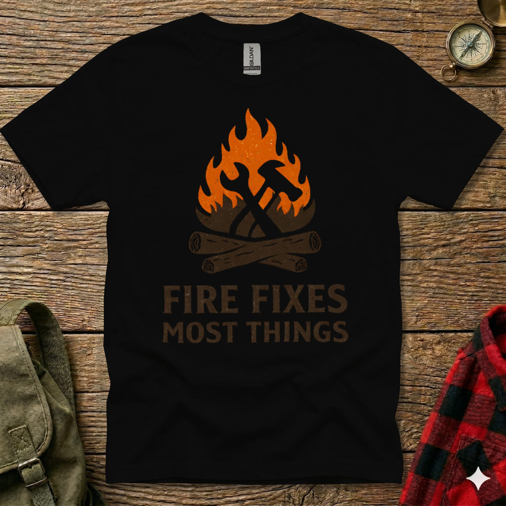 Black t-shirt with "Fire Fixes Most Things" text and graphic of tools and campfire.