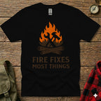Black t-shirt with "Fire Fixes Most Things" text and graphic of tools and campfire.