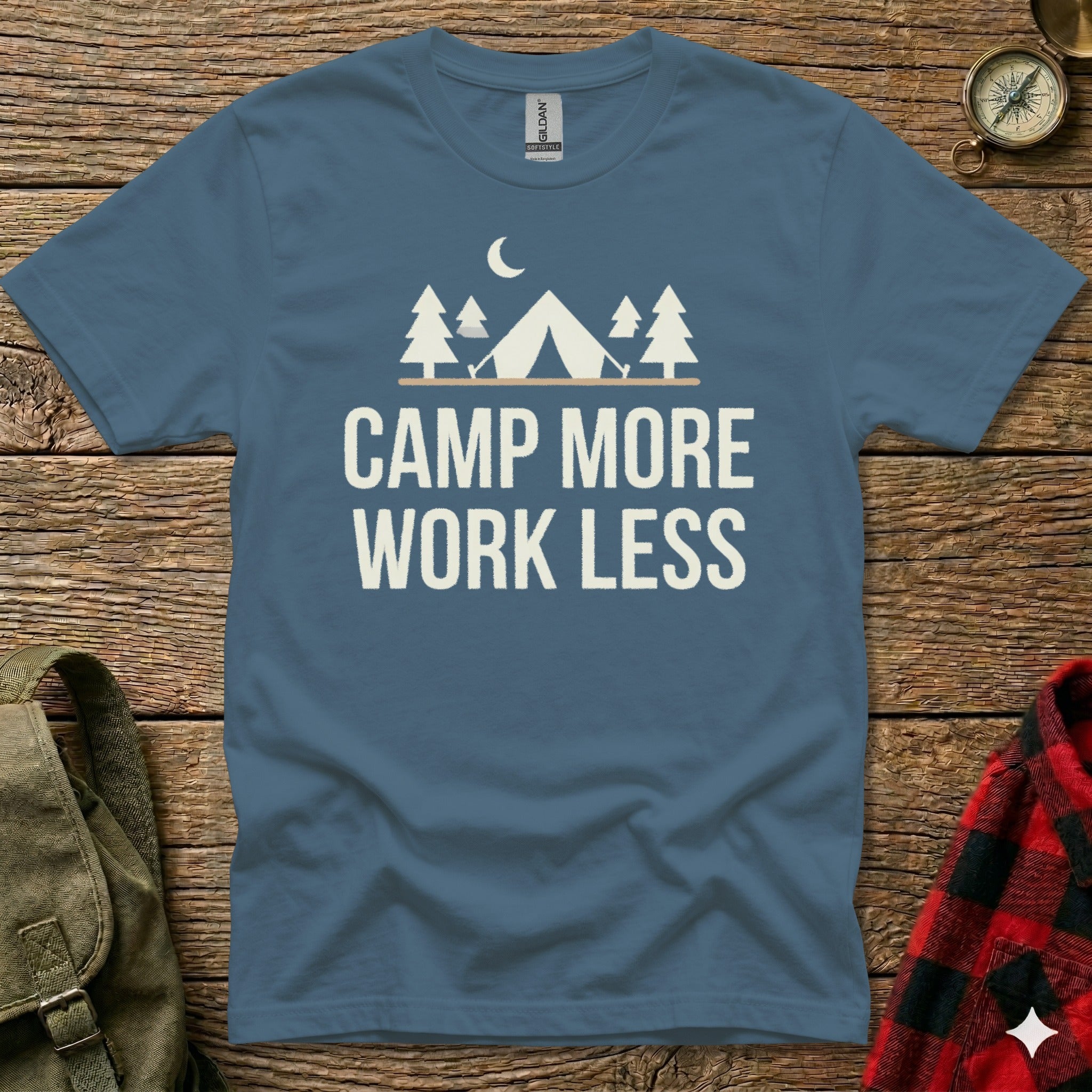 Blue t-shirt with "Camp More Work Less" and tent graphics.