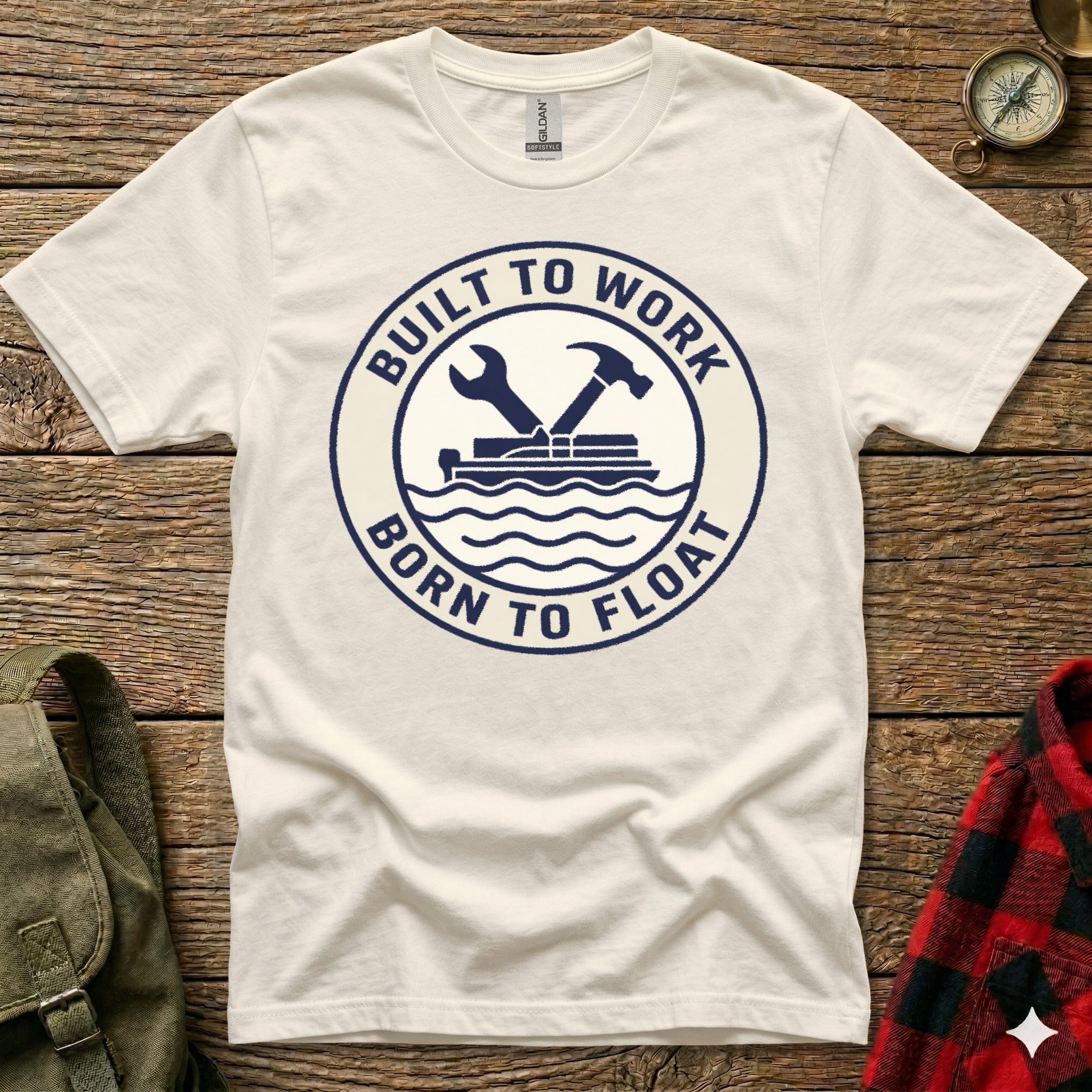 Cream t-shirt with dark blue circular graphic "Built to Work Born to Float".