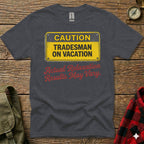 Dark grey t-shirt with yellow "CAUTION Tradesman on Vacation" sign.