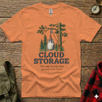 Orange t-shirt with "CLOUD STORAGE" graphic of a bag hanging from a tree.