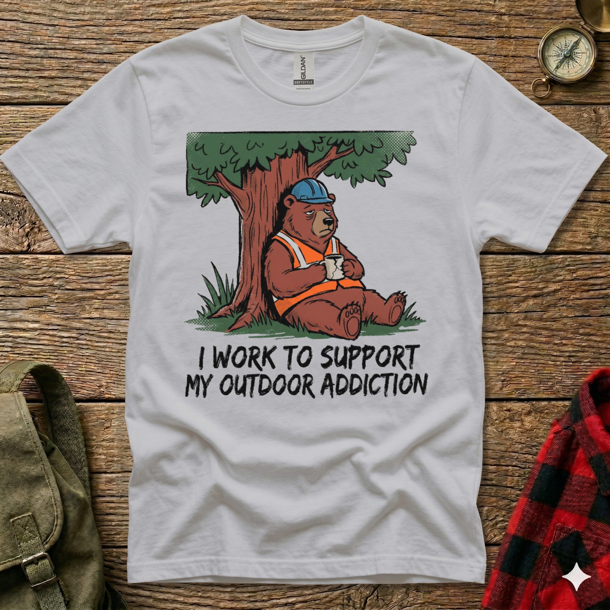 Bear in hard hat sips coffee under tree, "I Work To Support My Outdoor Addiction" text.