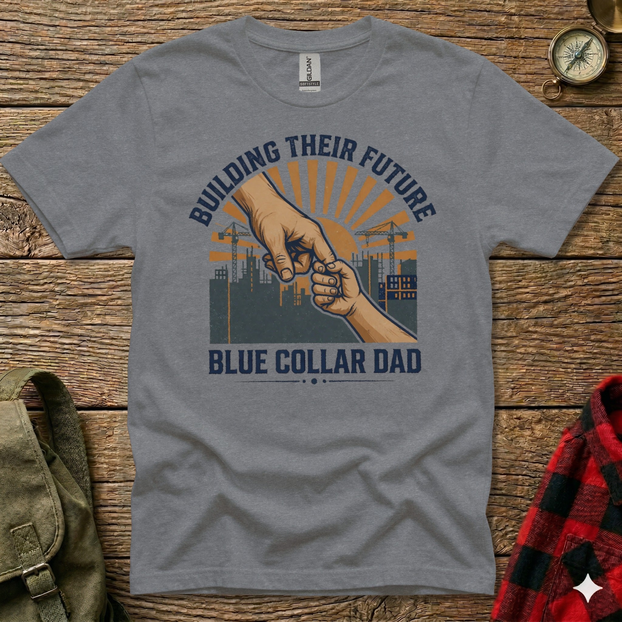T-shirt with "Building Their Future" and "Blue Collar Dad" text, featuring hands and construction imagery.
