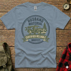 "Husband Material Certified Reliable (Mostly)" graphic on a grey t-shirt.