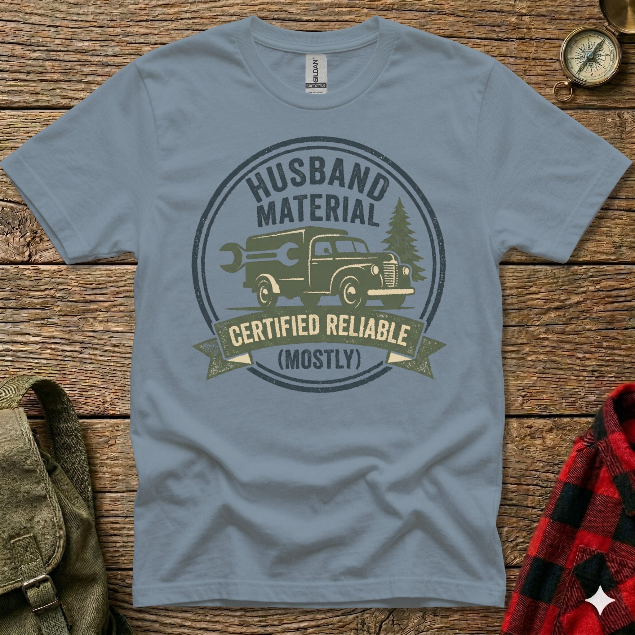 "Husband Material Certified Reliable (Mostly)" graphic on a grey t-shirt.