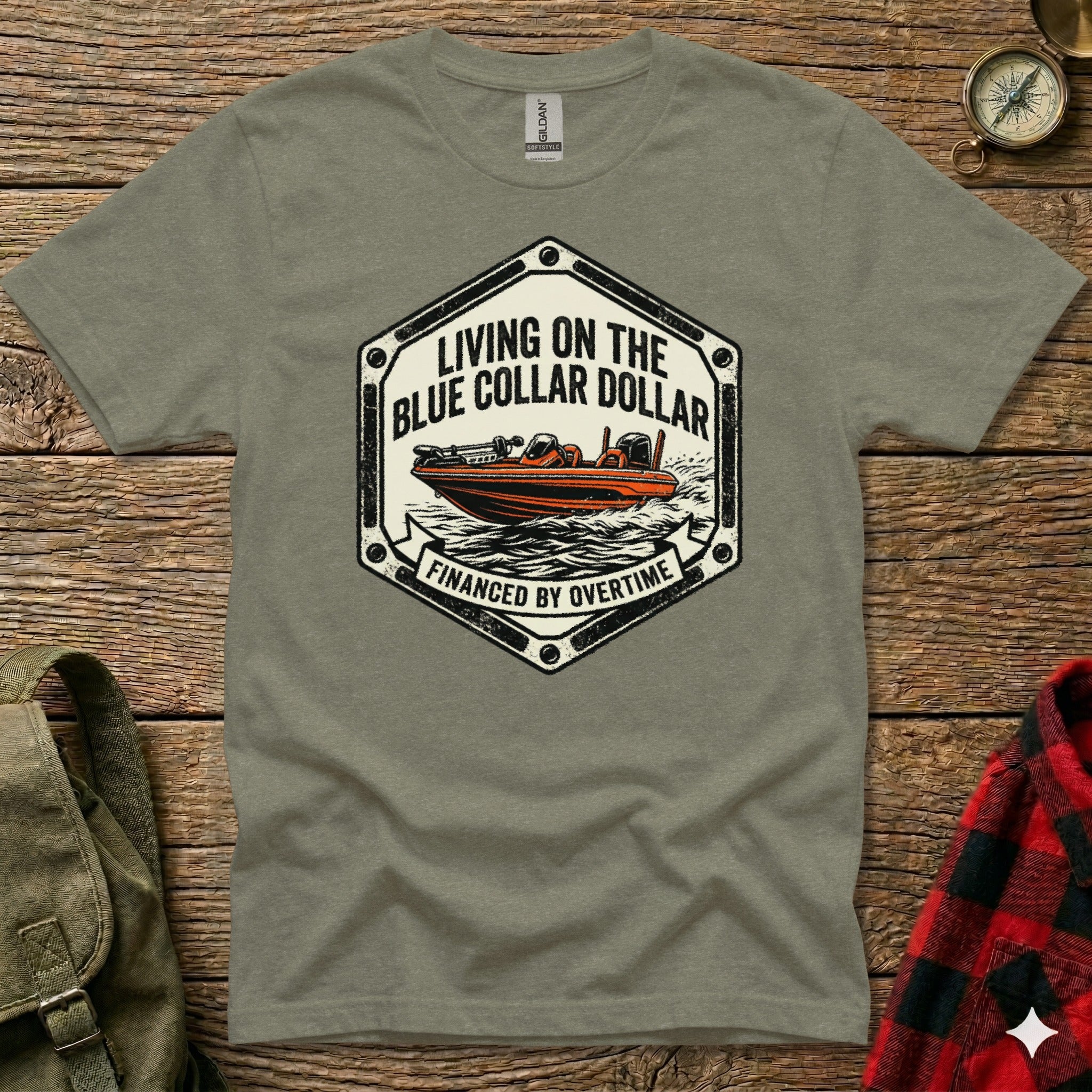T-shirt graphic: speedboat on water, text "Living on the blue collar dollar financed by overtime".