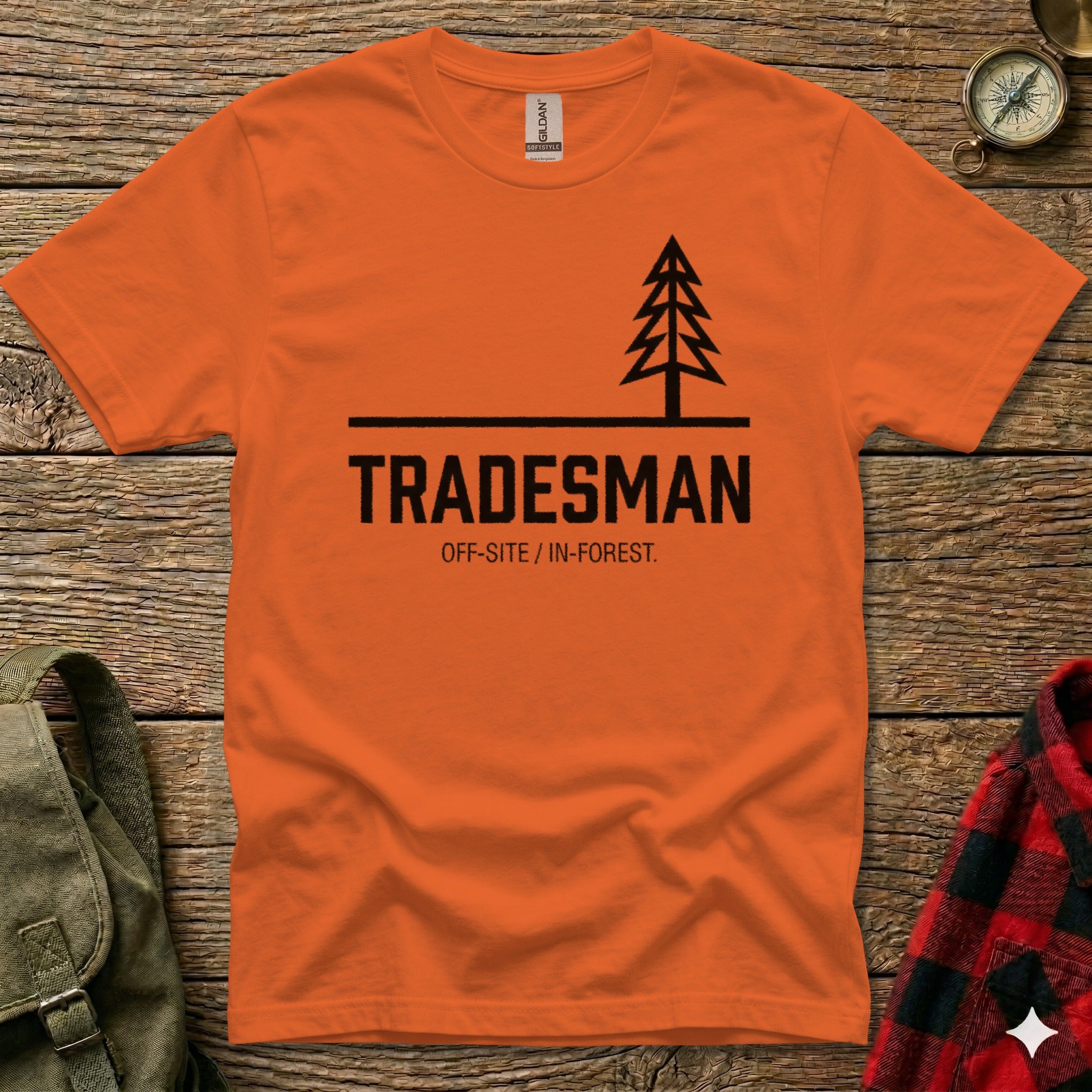 Orange t-shirt with "TRADESMAN OFF-SITE / IN-FOREST." and a tree silhouette.