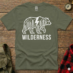 Olive green t-shirt with white geometric bear and "WILDERNESS" text.