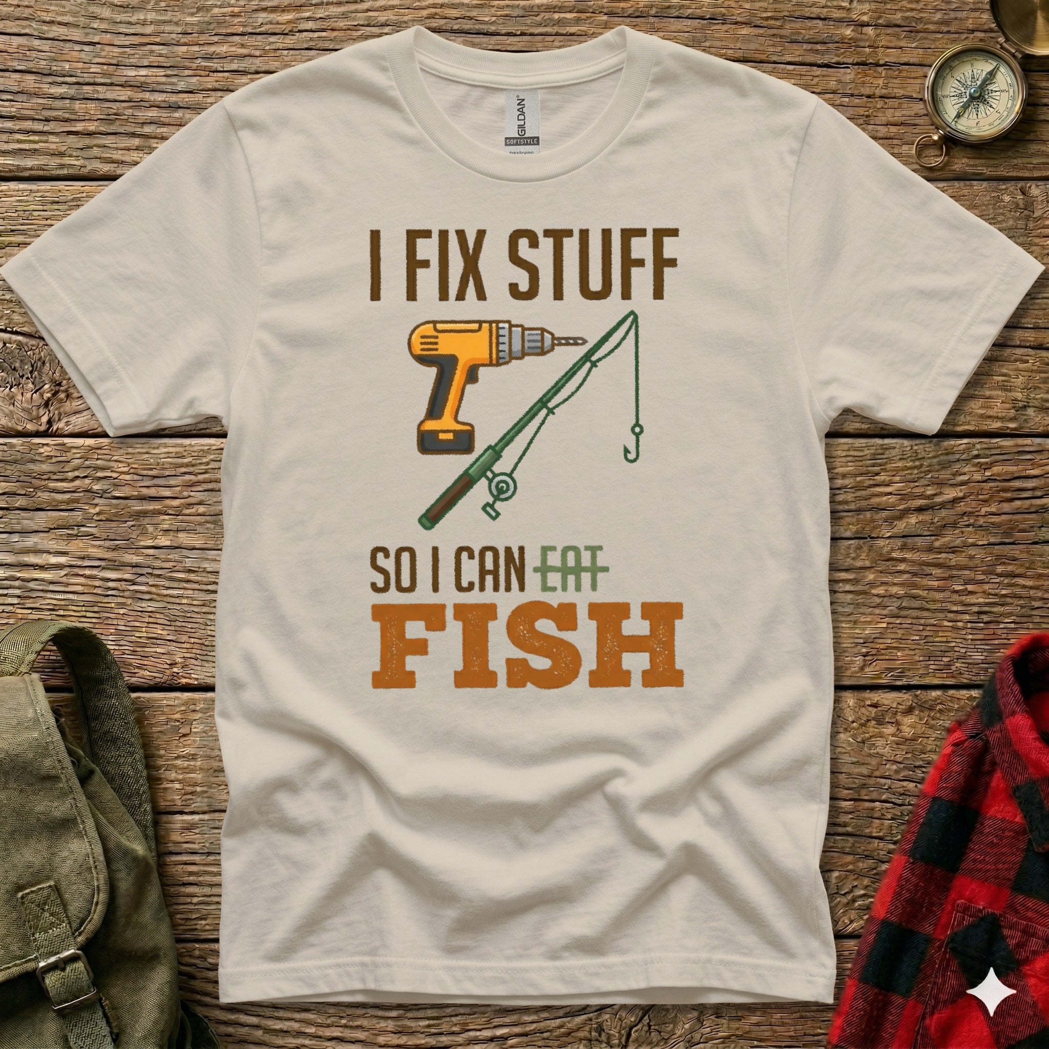 T-shirt with "I FIX STUFF SO I CAN EAT FISH" and drill/fishing rod graphic.