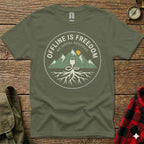 Olive t-shirt with circular graphic: mountains, roots, and "OFFLINE IS FREEDOM" text.