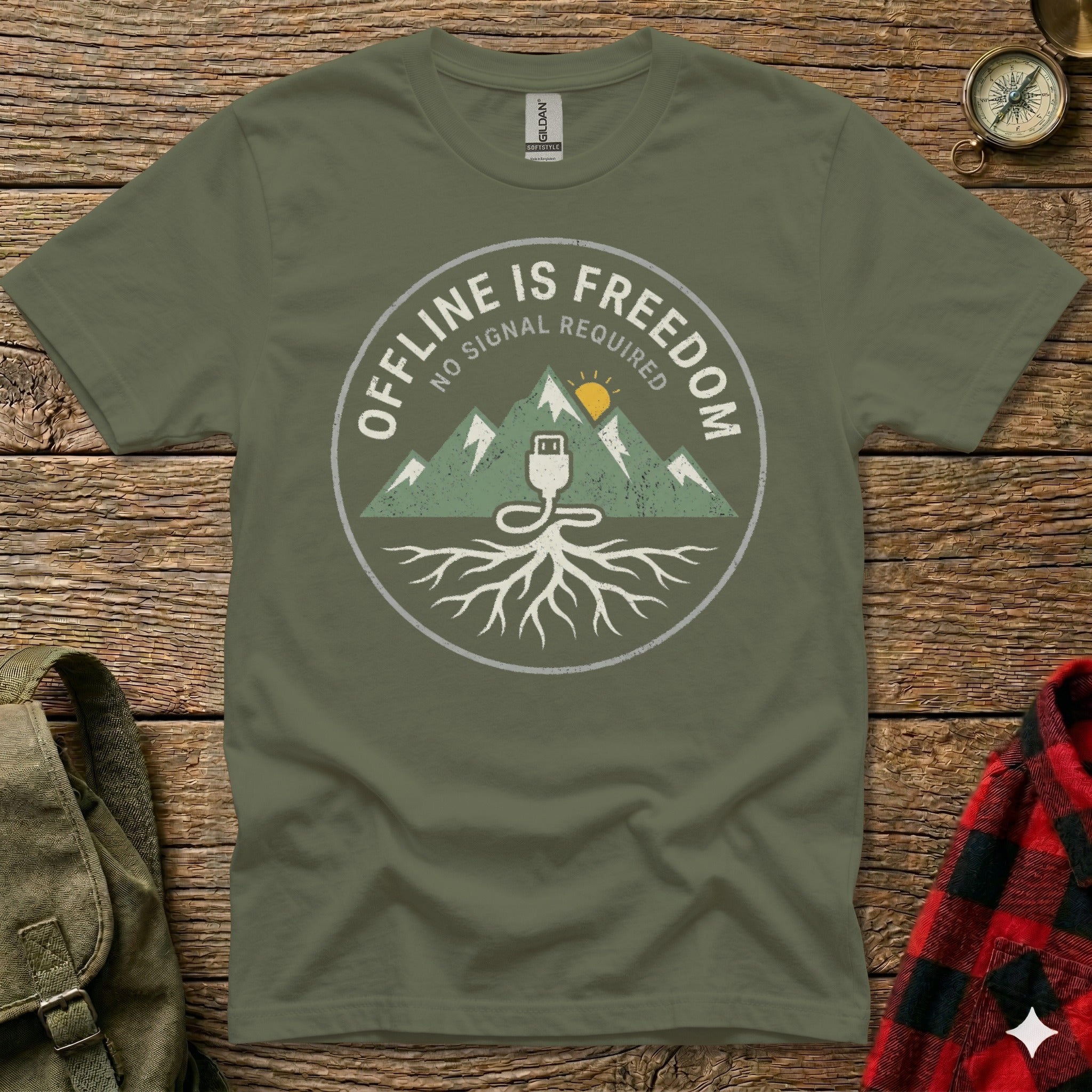 Olive t-shirt with circular graphic: mountains, roots, and "OFFLINE IS FREEDOM" text.
