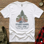 White t-shirt with a pine tree, hard hat, and lumberjack axe graphic.