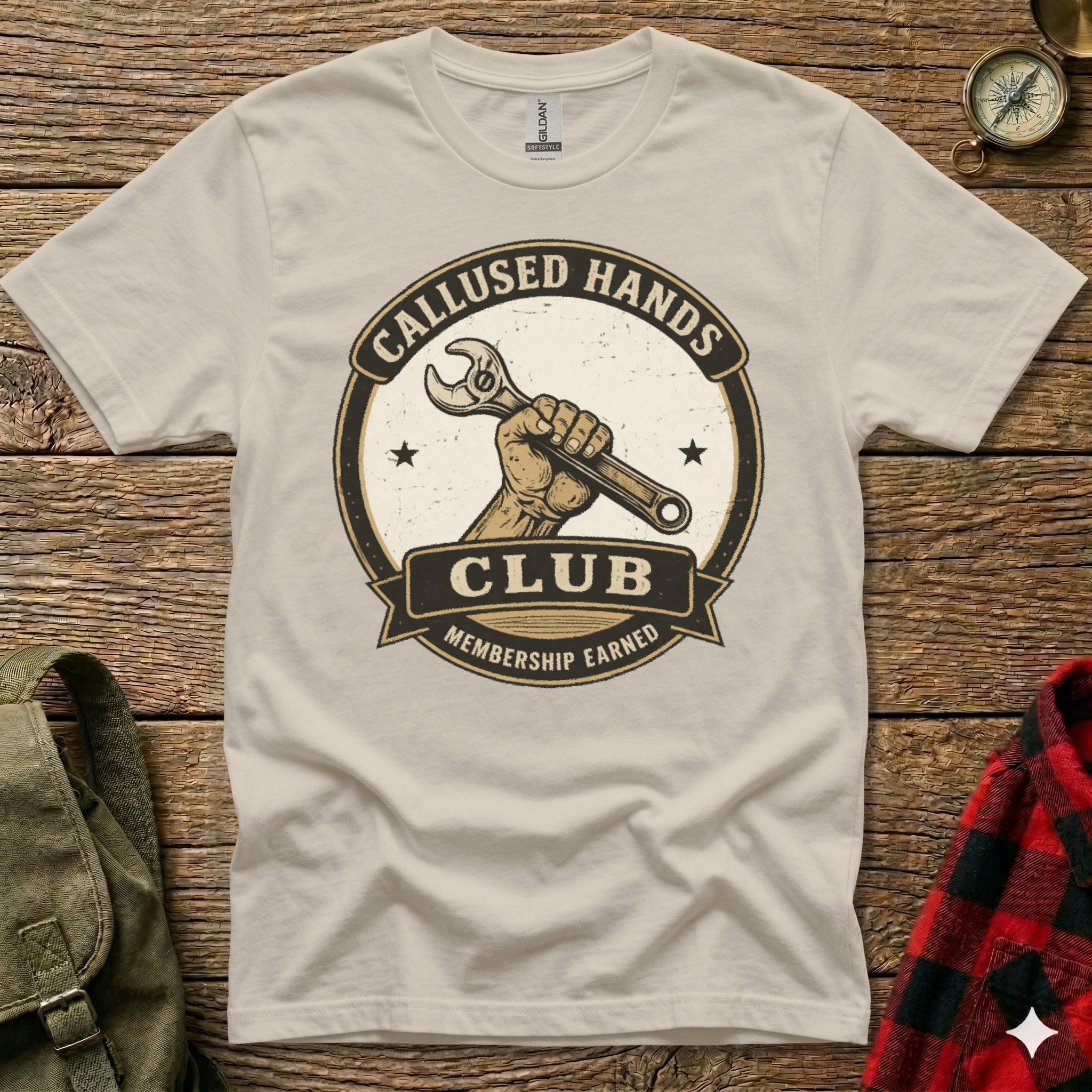 Cream t-shirt with "Callused Hands Membership Earned" circular logo featuring a hand holding a wrench.