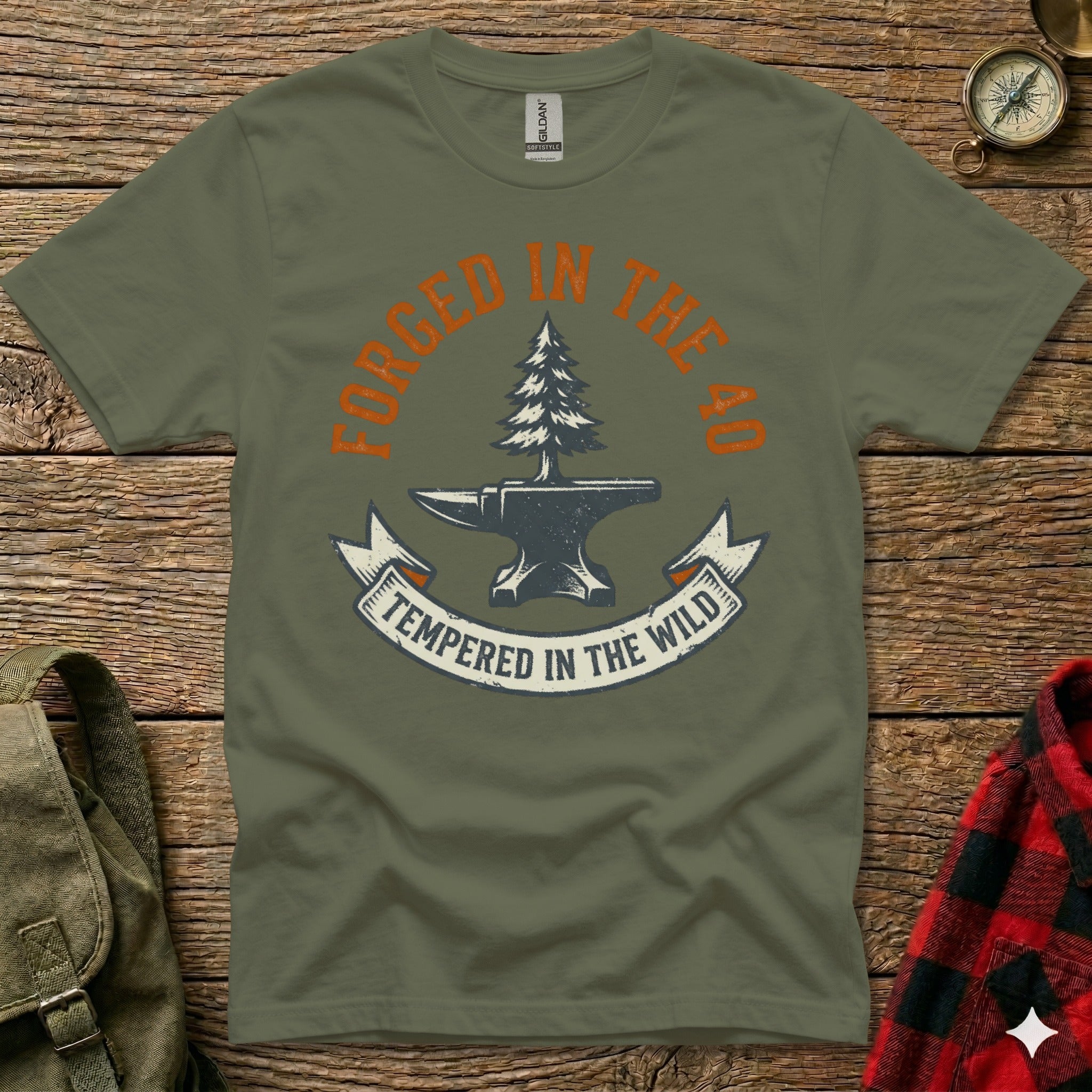 Olive t-shirt with anvil, tree, and text "Forged in the 40, Tempered in the Wild".