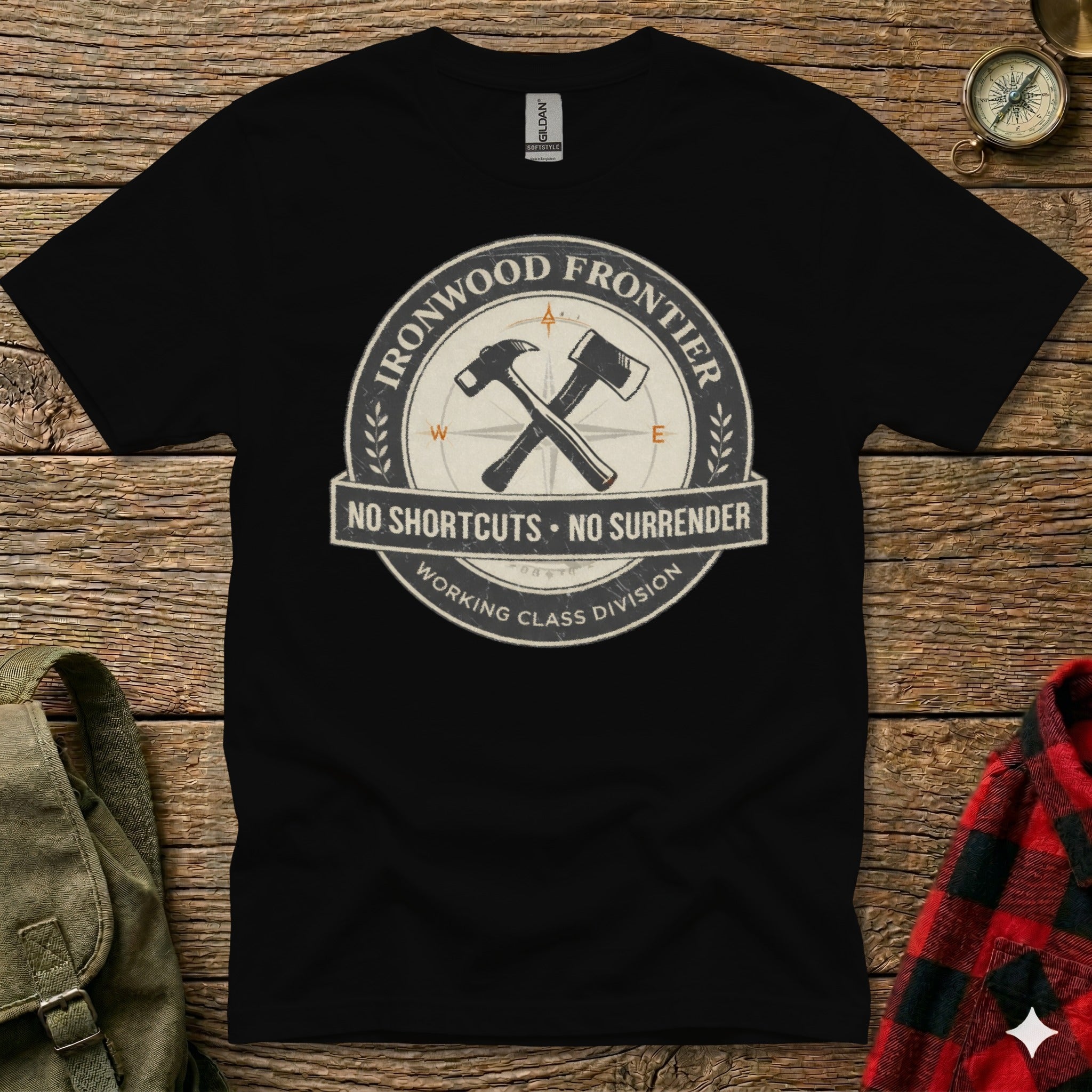 Black t-shirt with circular "Ironwood Frontier" logo featuring crossed tools and compass.