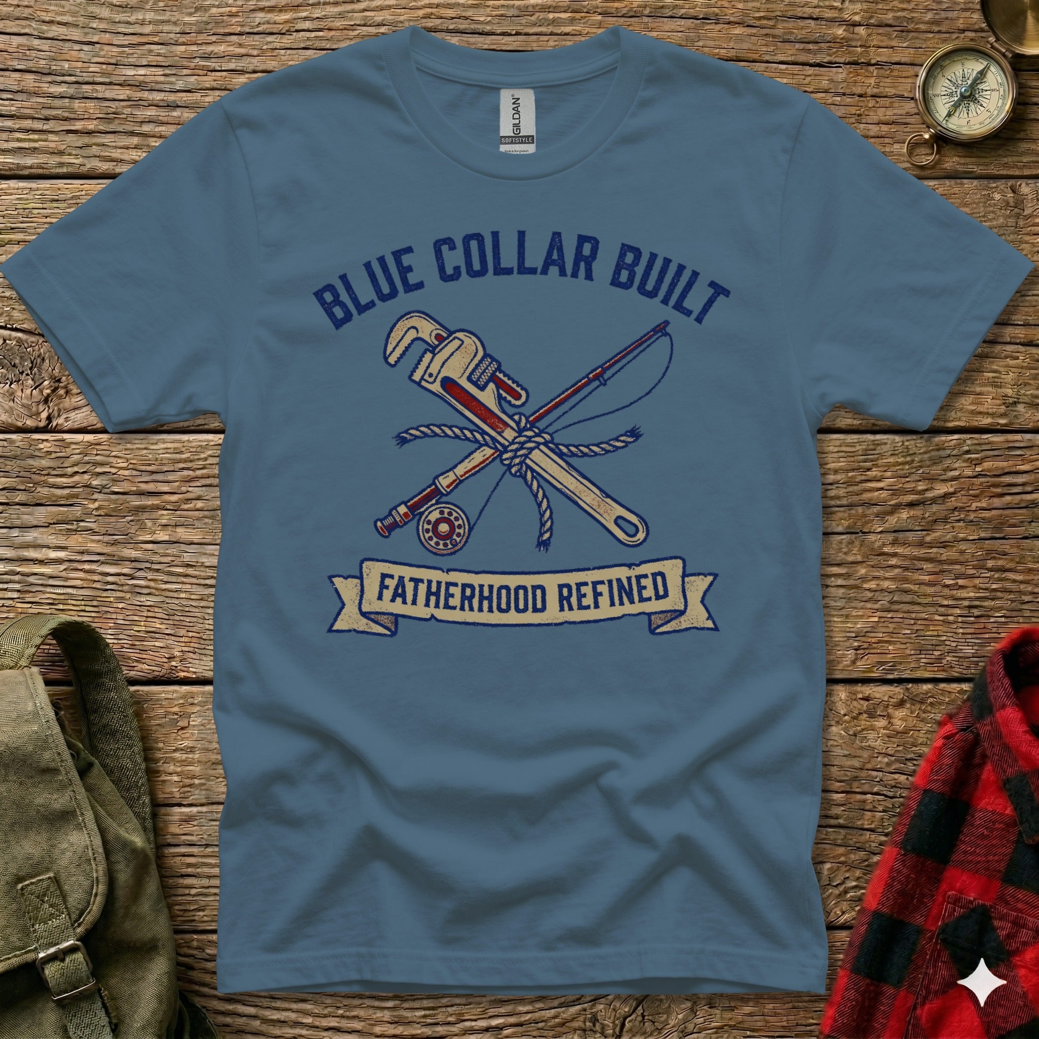 Blue t-shirt with "Blue Collar Built Fatherhood Refined" text and crossed tools.