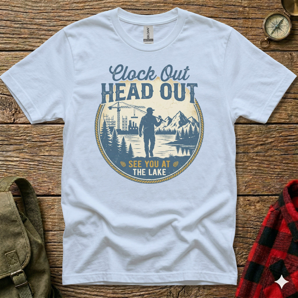 White t-shirt with "Clock Out Head Out See You At The Lake" text and nature graphic.