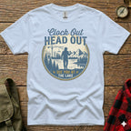 White t-shirt with "Clock Out Head Out See You At The Lake" text and nature graphic.