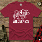 Maroon t-shirt with geometric bear design and "WILDERNESS" text.